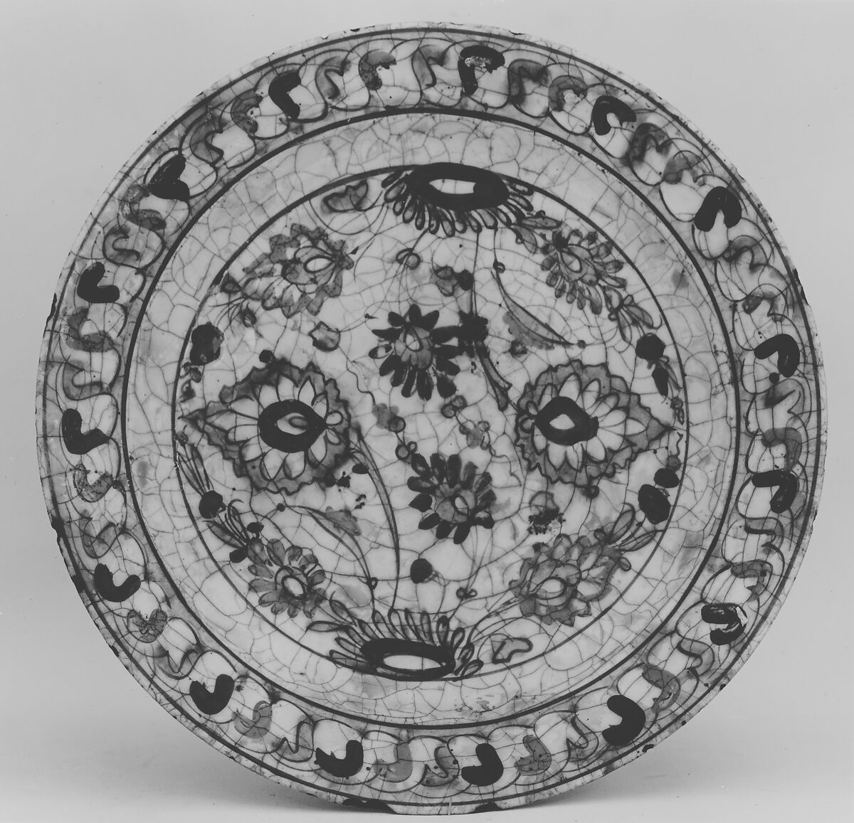 Dish, Stonepaste; underglaze painted in black, blue, and green with red and yellow slips