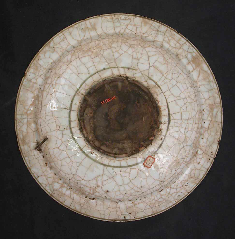 Dish, Stonepaste; underglaze painted in black, blue, and green with red and yellow slips