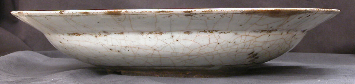 Dish, Stonepaste; underglaze painted in black, blue, and green with red and yellow slips