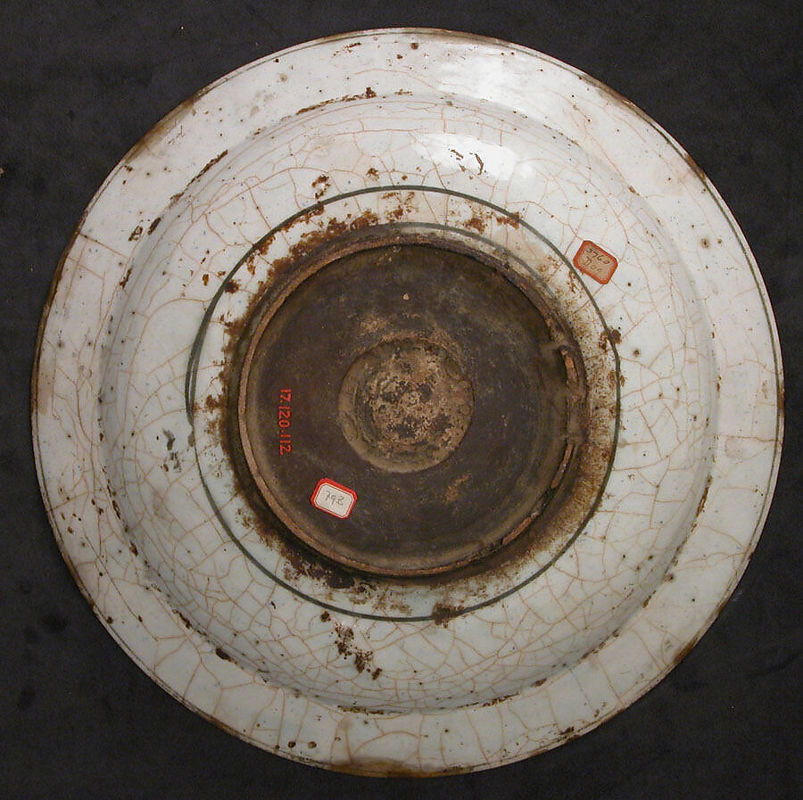 Dish, Stonepaste; underglaze painted in black, blue, and green with red and yellow slips