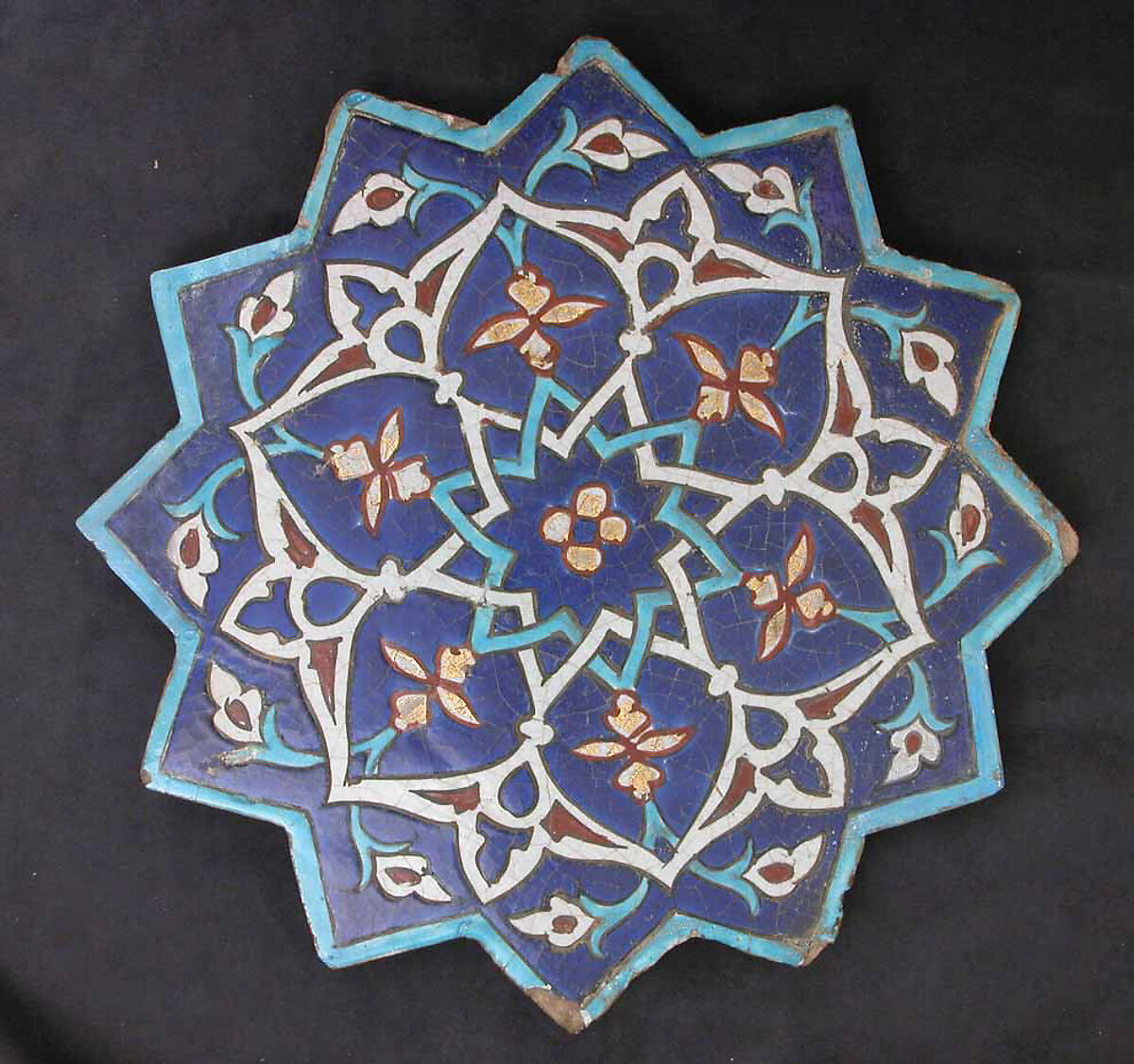 Twelve-Pointed Star-Shaped Tile, Stonepaste; polychrome glaze within black wax resist outlines (cuerda seca technique) 
