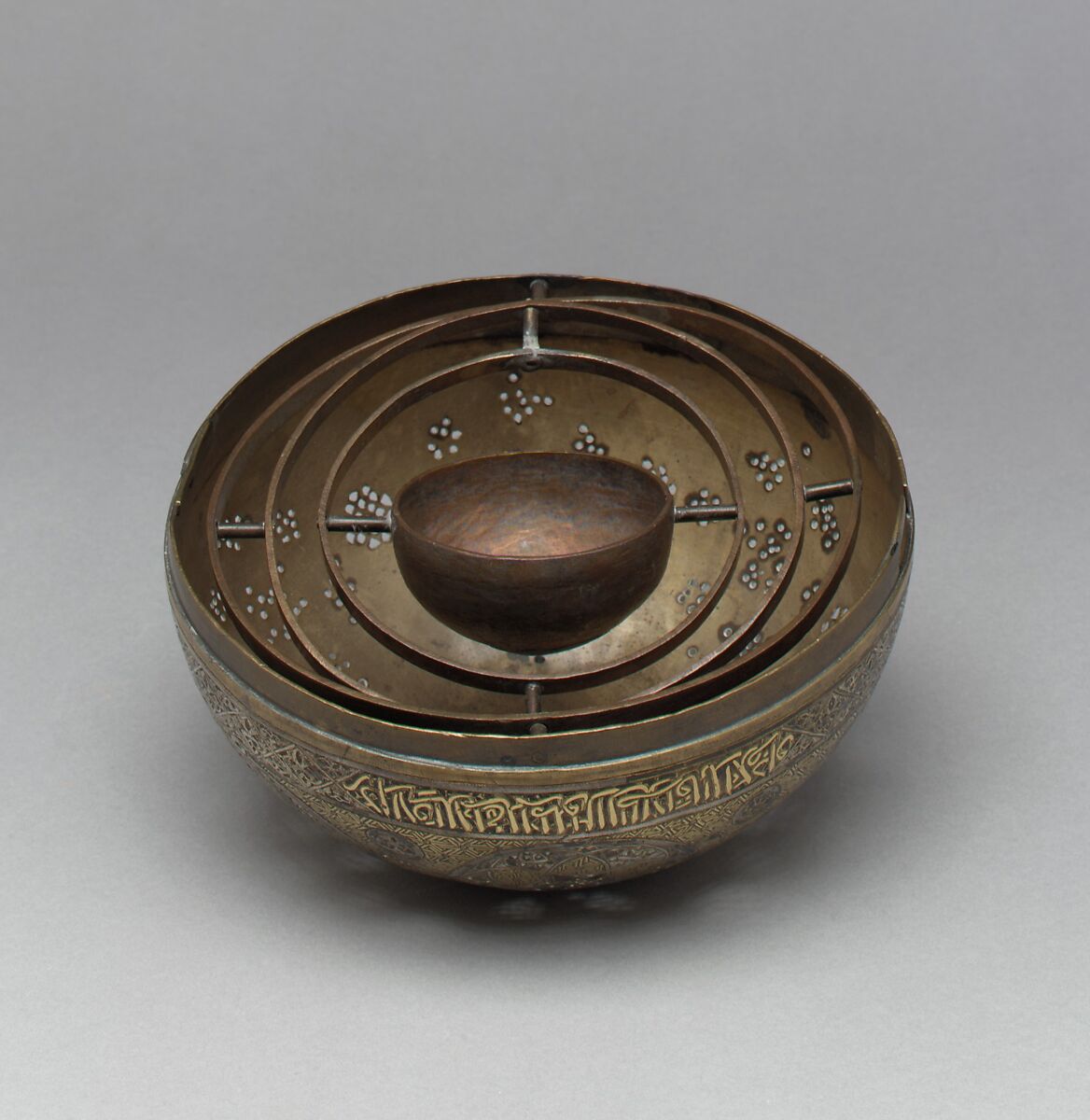 Pierced Globe, Brass; spun and turned, pierced, chased, inlaid with gold, silver, and black compound