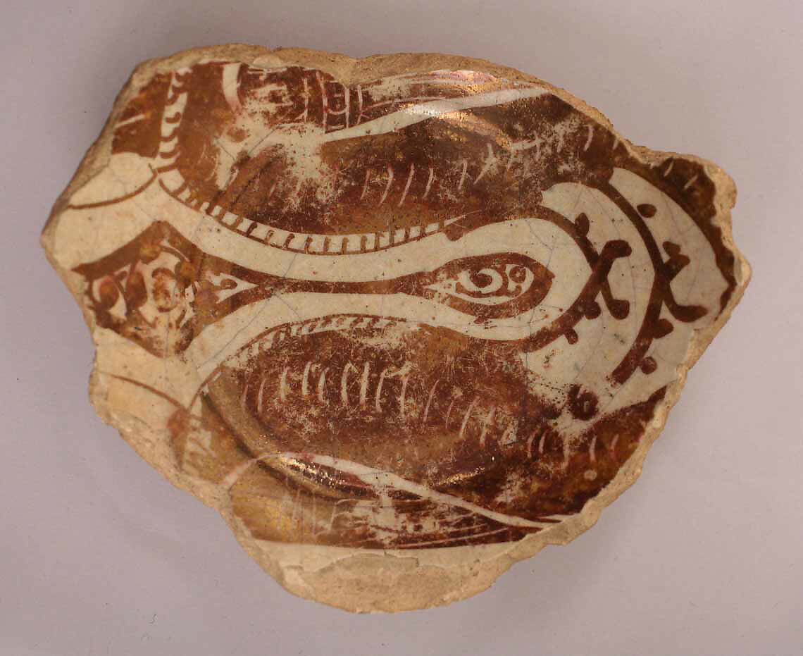 Fragment of a Bowl, Earthenware; luster-painted on opaque white glaze 
