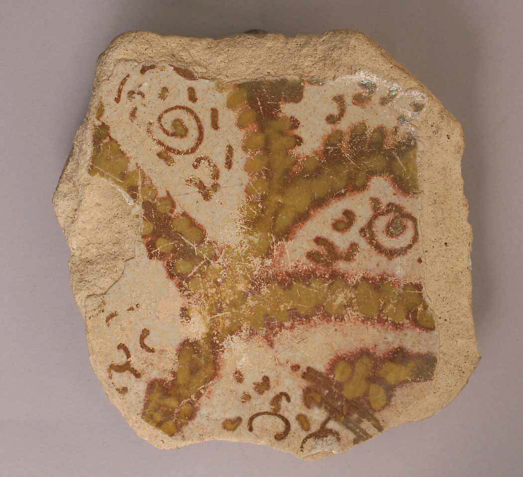 Fragment of a Bowl, Earthenware; luster-painted on opaque white glaze 