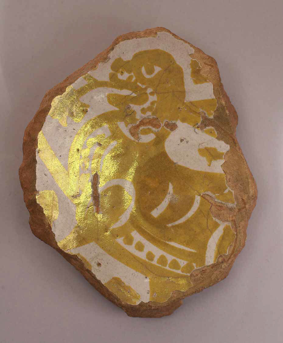 Fragment of a Bowl, Earthenware; luster-painted on opaque white glaze 