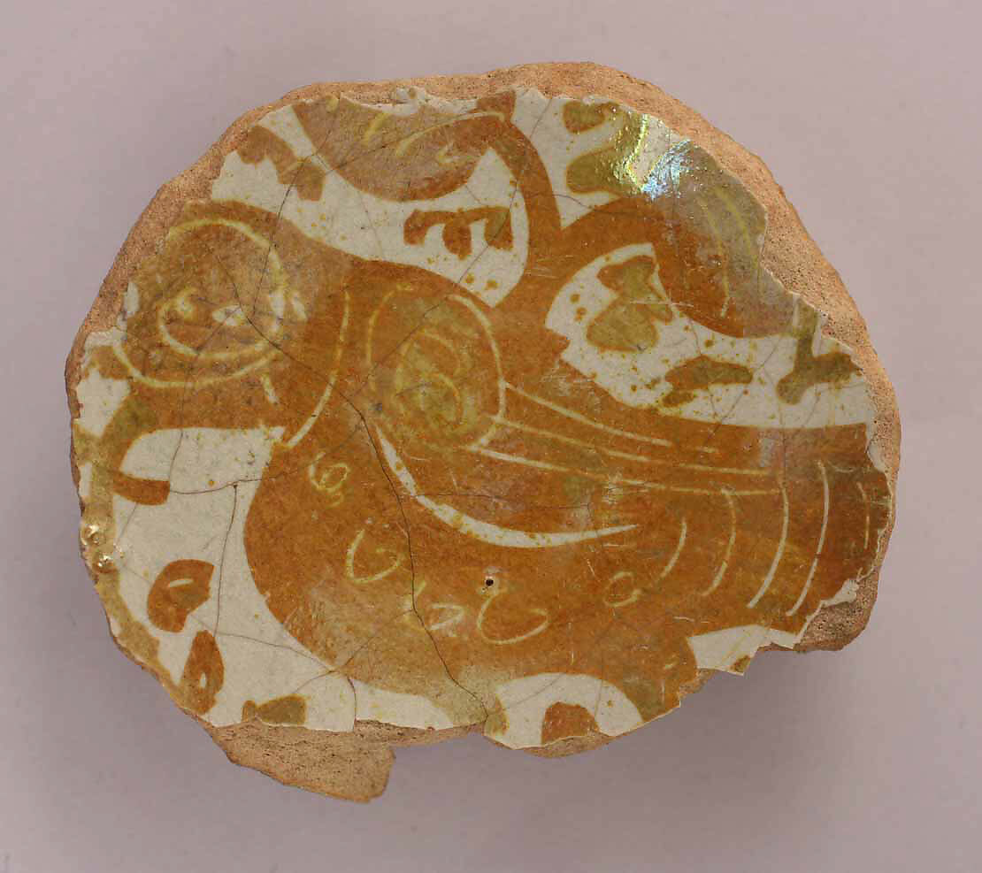 Fragment of a Bowl, Earthenware; luster-painted on opaque white glaze 