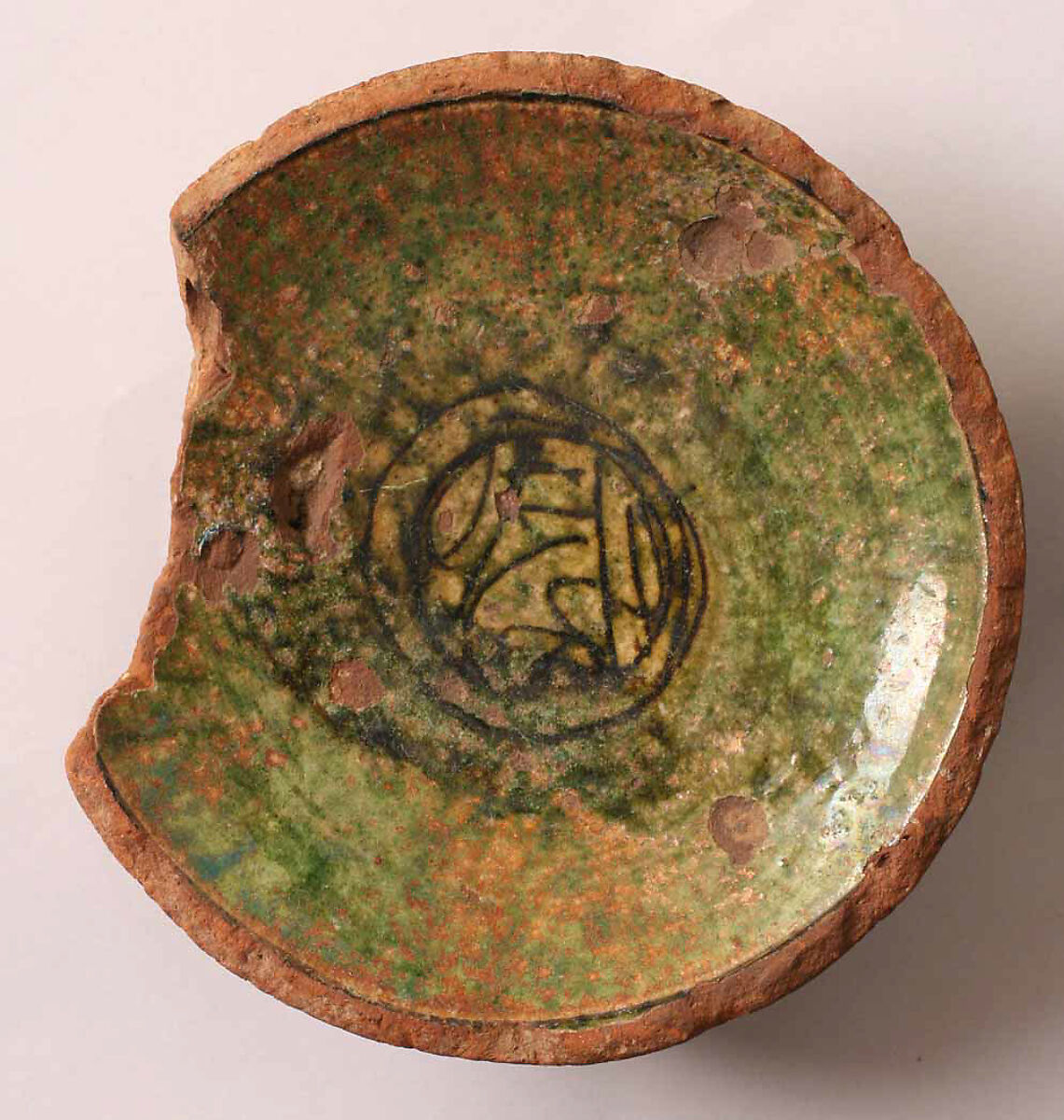 Fragment of a Bowl, Earthenware; incised decoration through white slip and coloring under transparent glaze. 