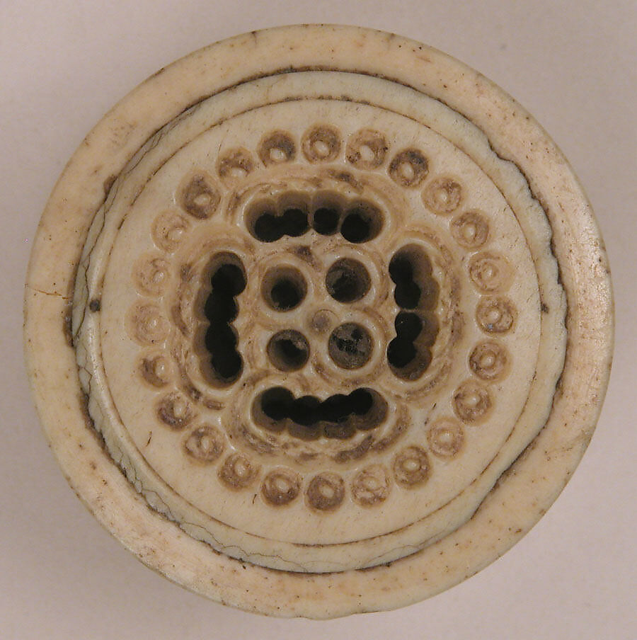 Spool, Bone; pierced, incised, and inlaid with paint 