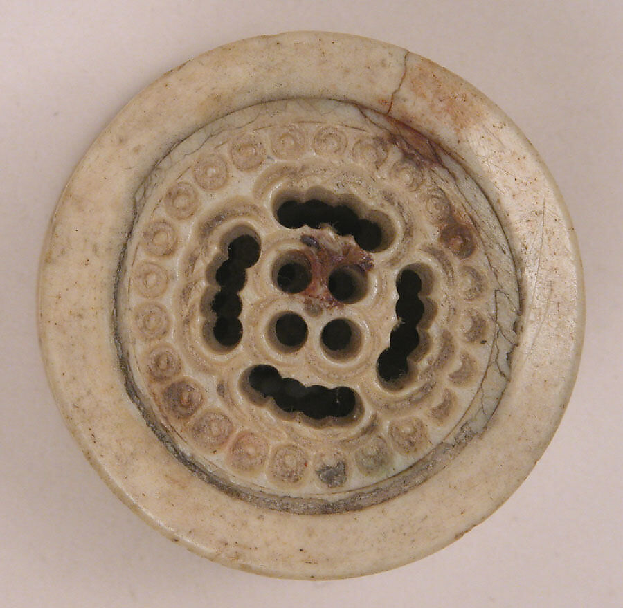 Spool, Bone; pierced, incised, and inlaid with paint