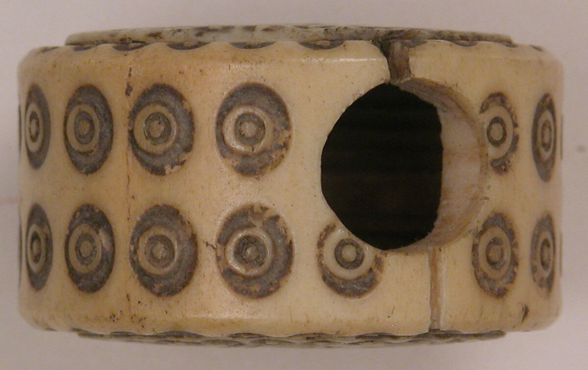 Spool, Bone; pierced, incised, and inlaid with paint