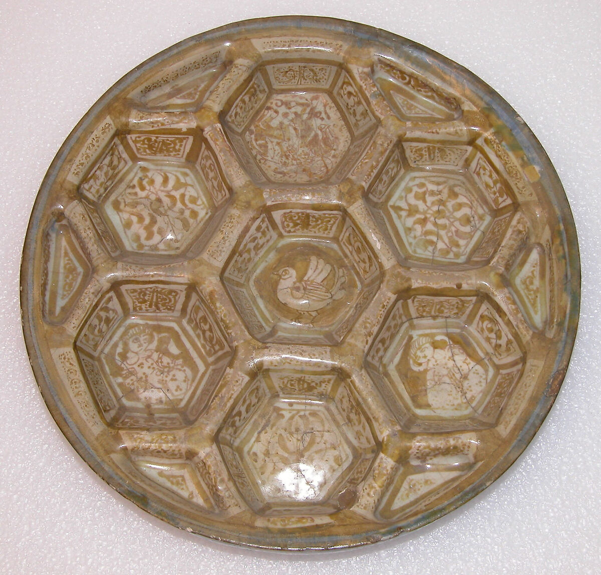 Dish, Stonepaste; molded; luster-painted on opaque white glaze under transparent colorless glaze 