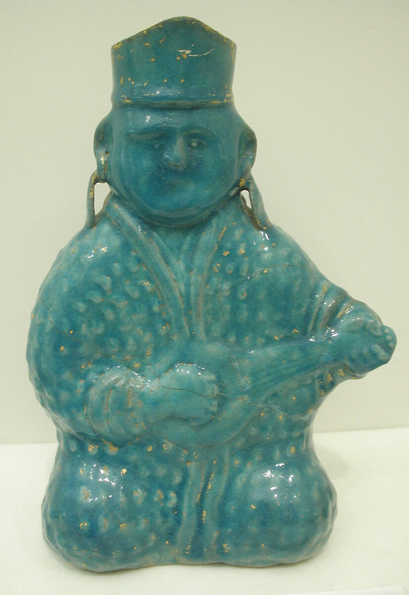 Bottle in the Form of a Lute Player, Stonepaste; molded, turquoise-glazed, partially gilded