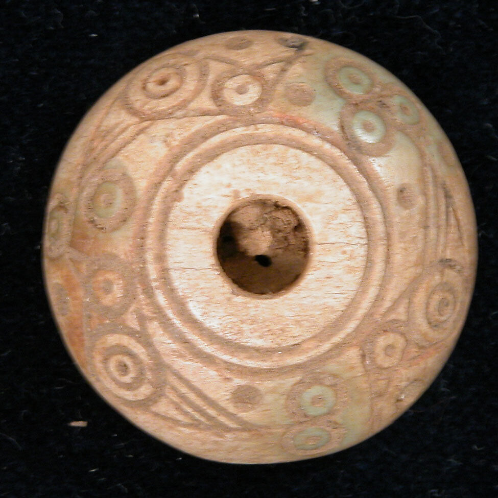Spindle Whorl or Button, Bone; tinted, incised, and inlaid with paint