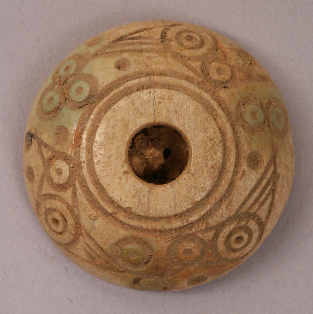Spindle Whorl or Button, Bone; tinted, incised, and inlaid with paint 