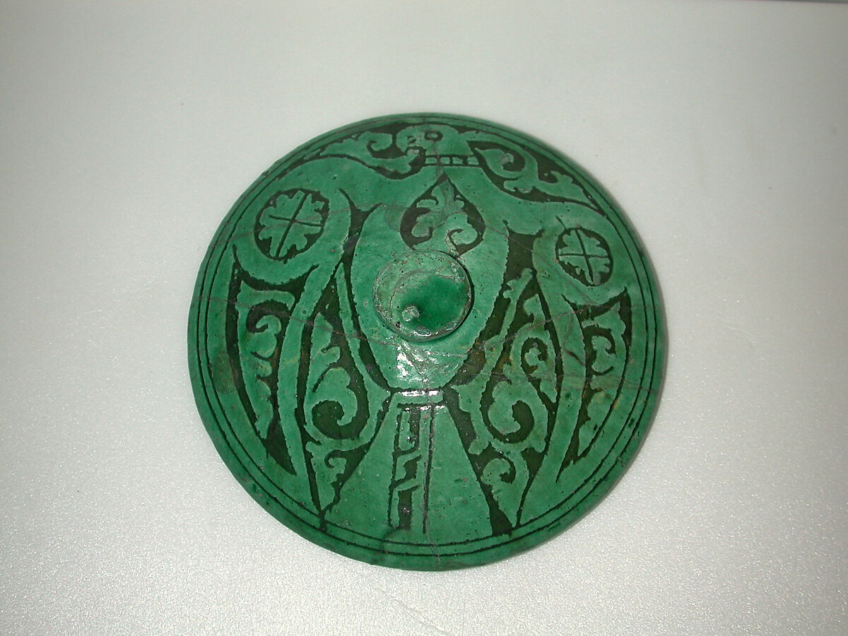 Lid, Earthenware; white slip-covered, carved decoration under a monochrome glaze (Garrus ware) 