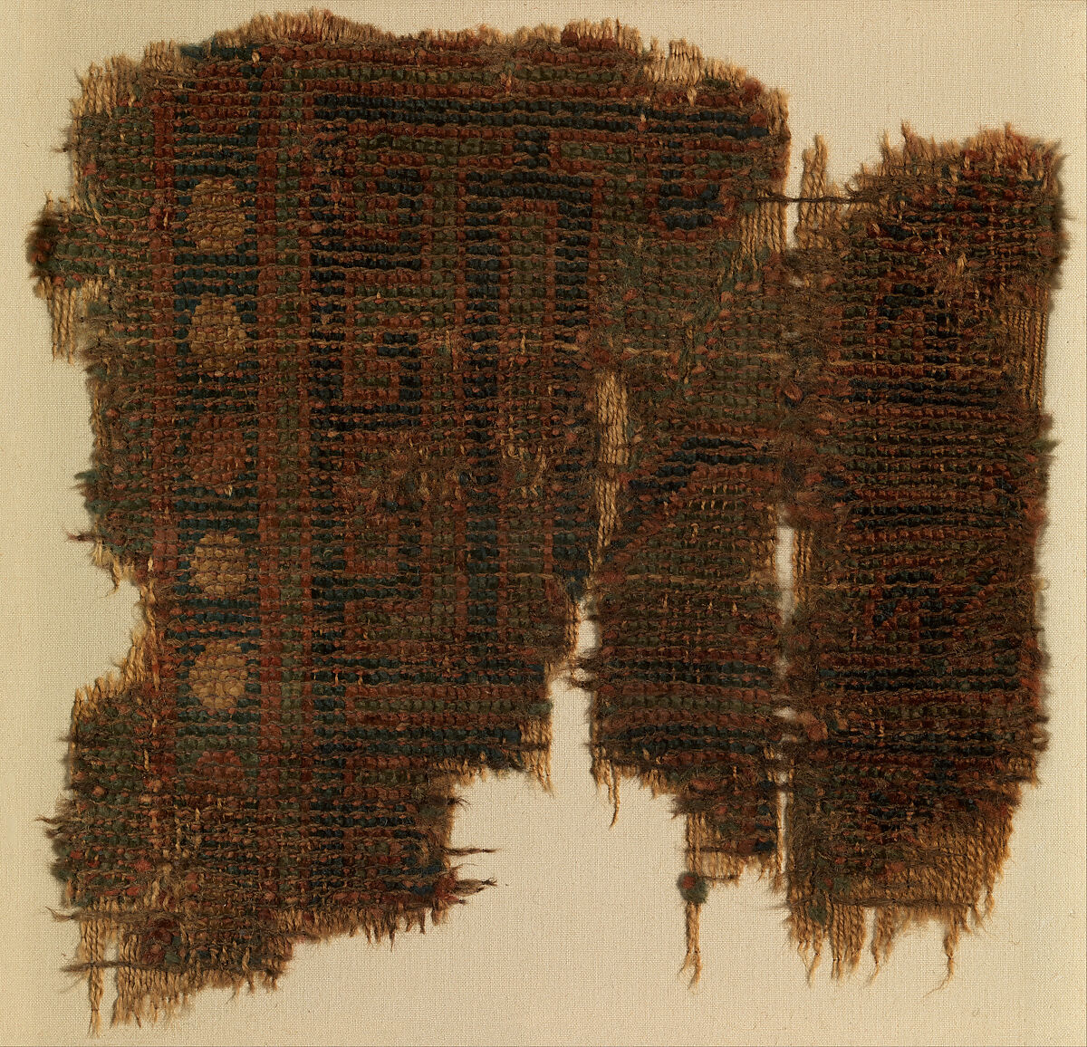 Fragment of a Carpet with Geometric Design, Wool (warp, weft and pile); symmetrically knotted pile 