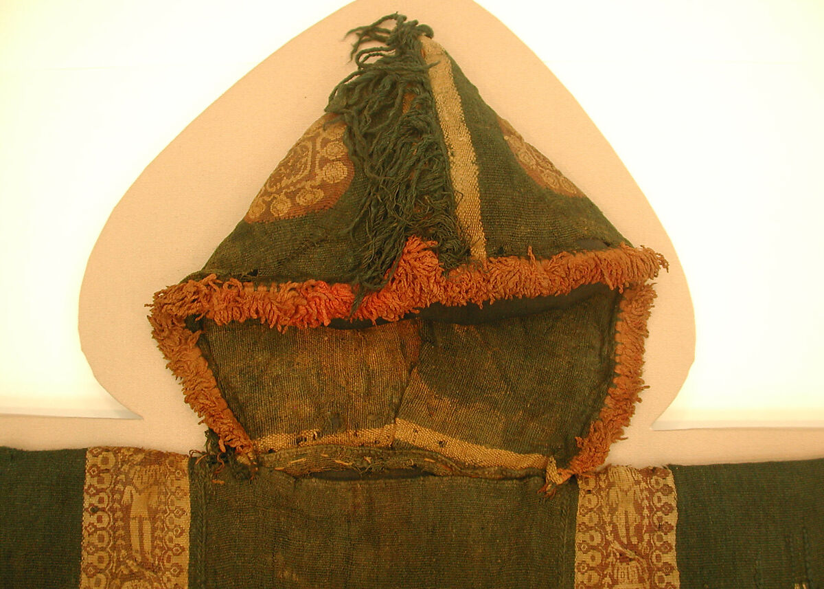 Child's Tunic with Hood, Tapestry weave in purple-colored, red-brown, and undyed wool on plain-weave ground of green wool; fringes in green and red-brown along the perimeter of the hood and lower edges