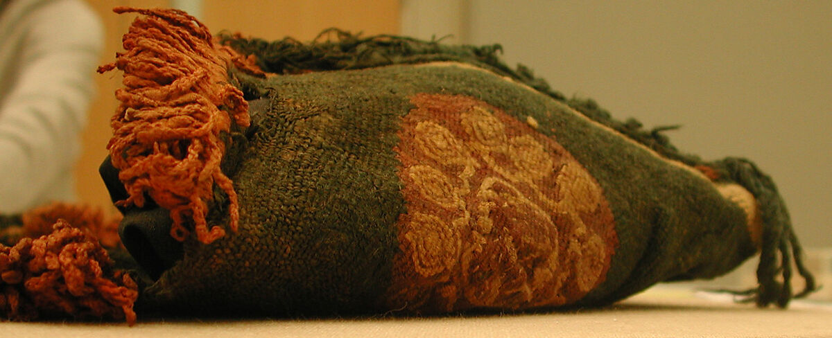 Child's Tunic with Hood, Tapestry weave in purple-colored, red-brown, and undyed wool on plain-weave ground of green wool; fringes in green and red-brown along the perimeter of the hood and lower edges