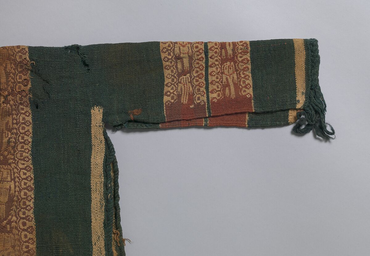 Child's Tunic with Hood, Tapestry weave in purple-colored, red-brown, and undyed wool on plain-weave ground of green wool; fringes in green and red-brown along the perimeter of the hood and lower edges