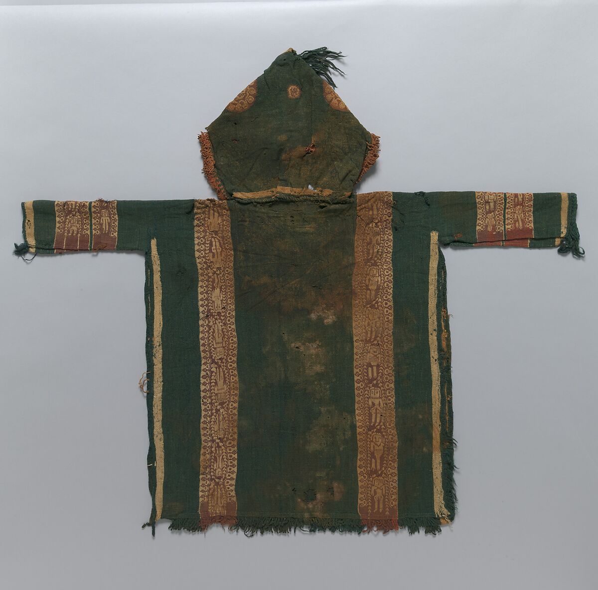 Child's Tunic with Hood, Tapestry weave in purple-colored, red-brown, and undyed wool on plain-weave ground of green wool; fringes in green and red-brown along the perimeter of the hood and lower edges