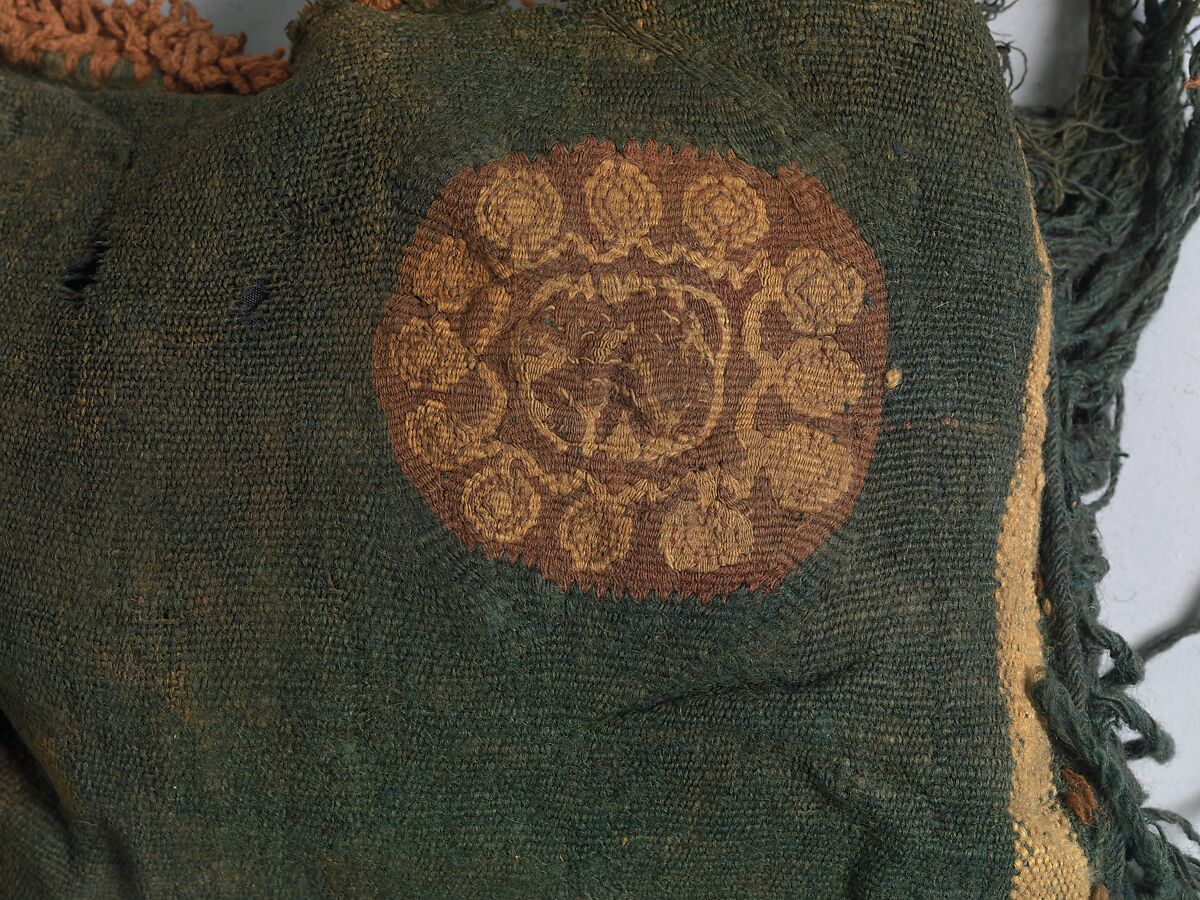 Child's Tunic with Hood, Tapestry weave in purple-colored, red-brown, and undyed wool on plain-weave ground of green wool; fringes in green and red-brown along the perimeter of the hood and lower edges