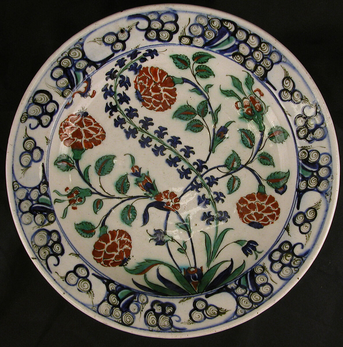 Dish, Stonepaste; polychrome painted under transparent glaze 