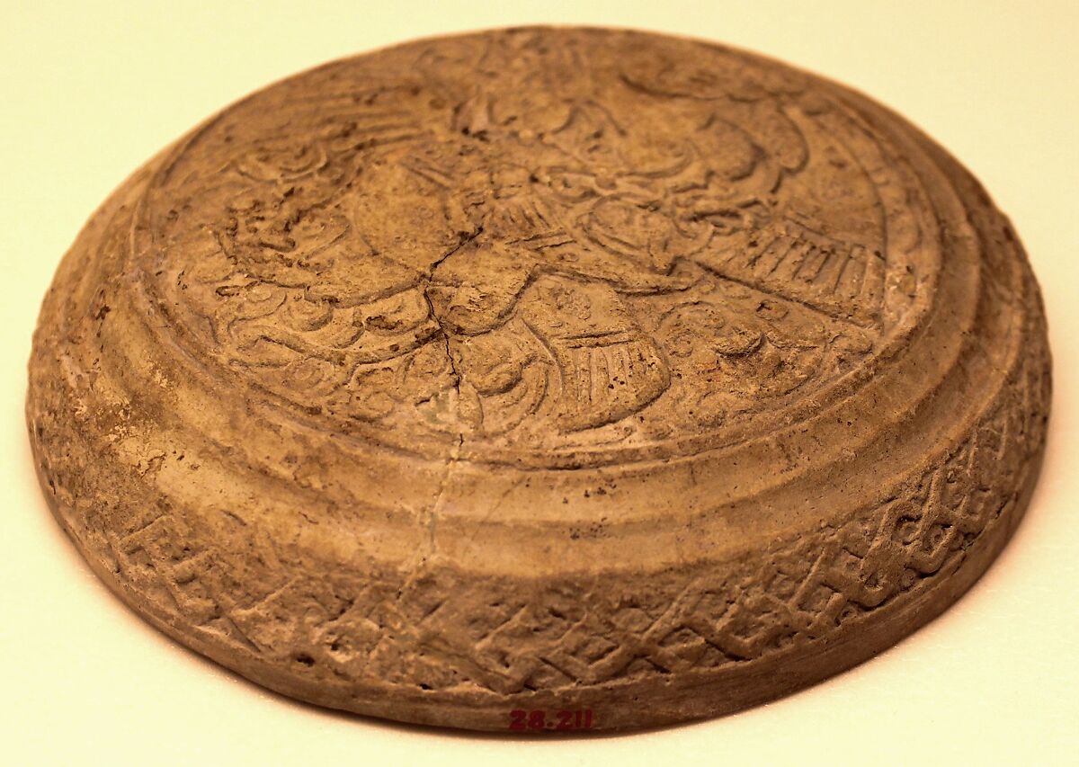 Lid, Yellowish white earthenware; unglazed