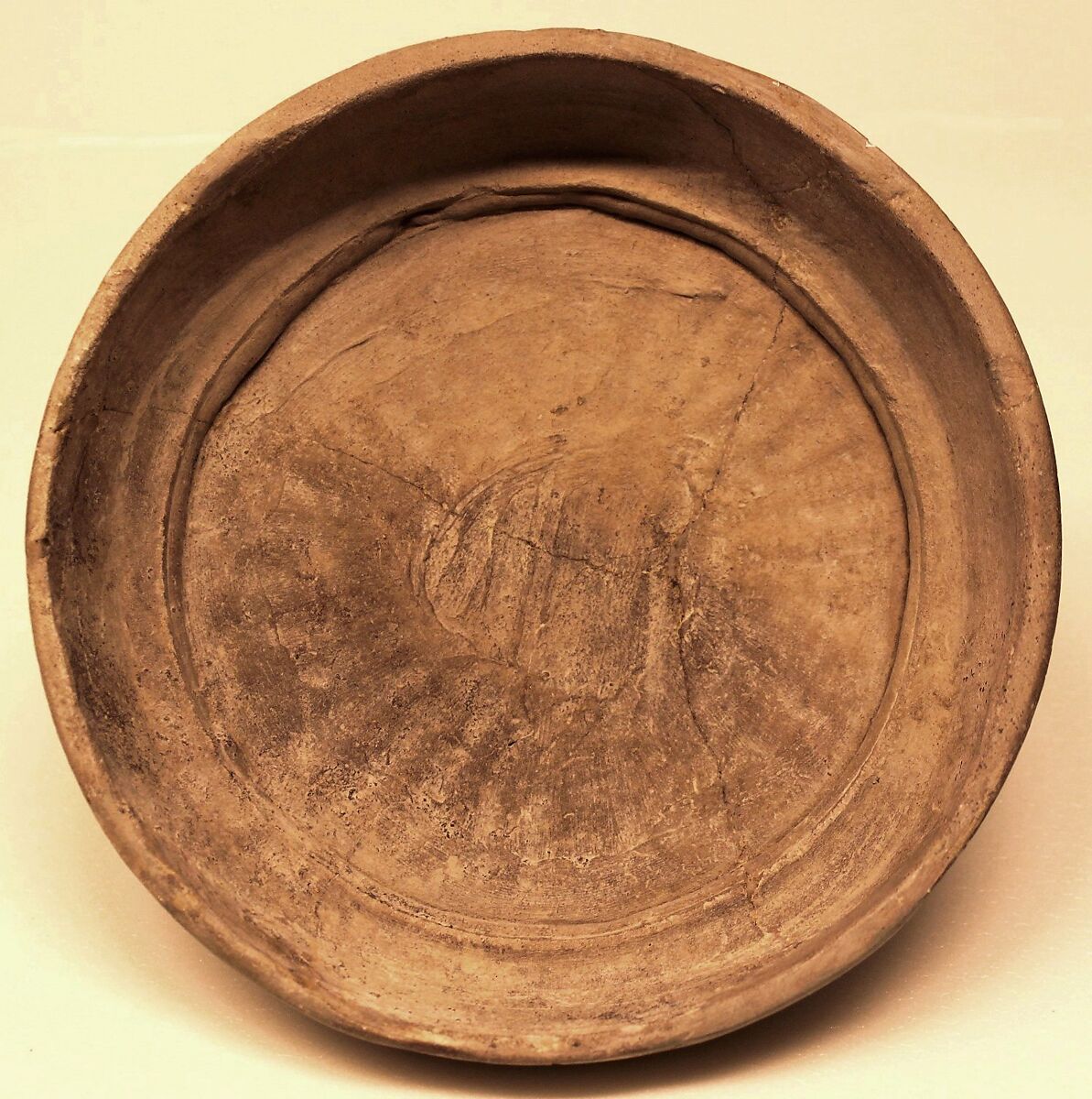 Lid, Yellowish white earthenware; unglazed