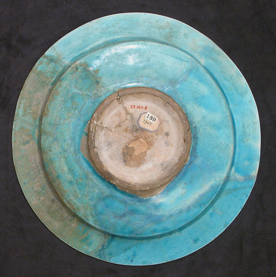 Dish with Carved Arabic Inscription in Floriated Kufic Reading "al-'izz" ("Glory"), Stonepaste; carved and glazed