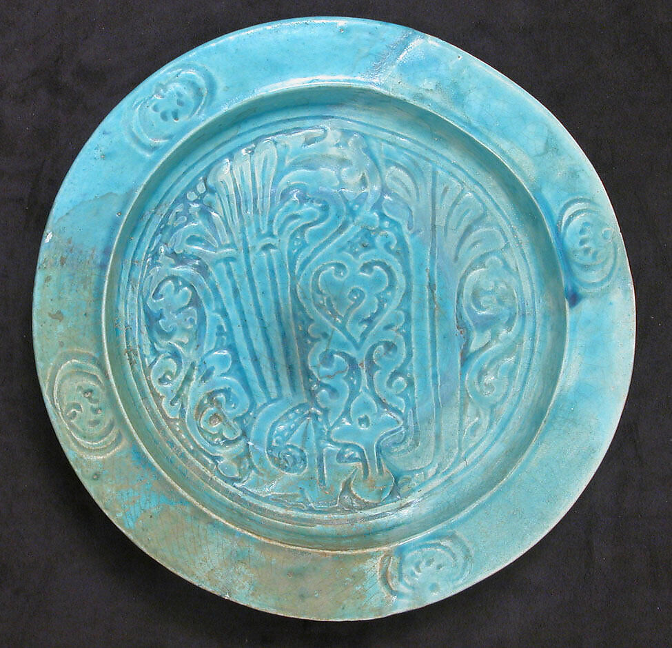 Dish with Carved Arabic Inscription in Floriated Kufic Reading "al-'izz" ("Glory"), Stonepaste; carved and glazed