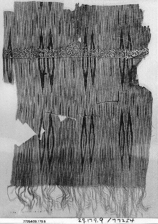 Tiraz Textile Fragment, Cotton, ink, and gold; plain weave, resist-dyed (ikat), painted
Inscription: black ink and gold leaf; painted
