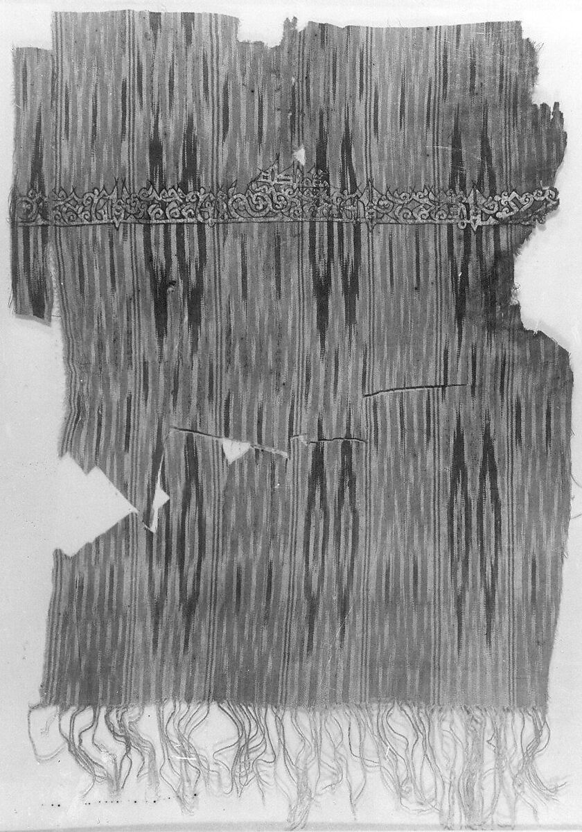 Tiraz Textile Fragment, Cotton, ink, and gold; plain weave, resist-dyed (ikat), painted
Inscription: black ink and gold leaf; painted