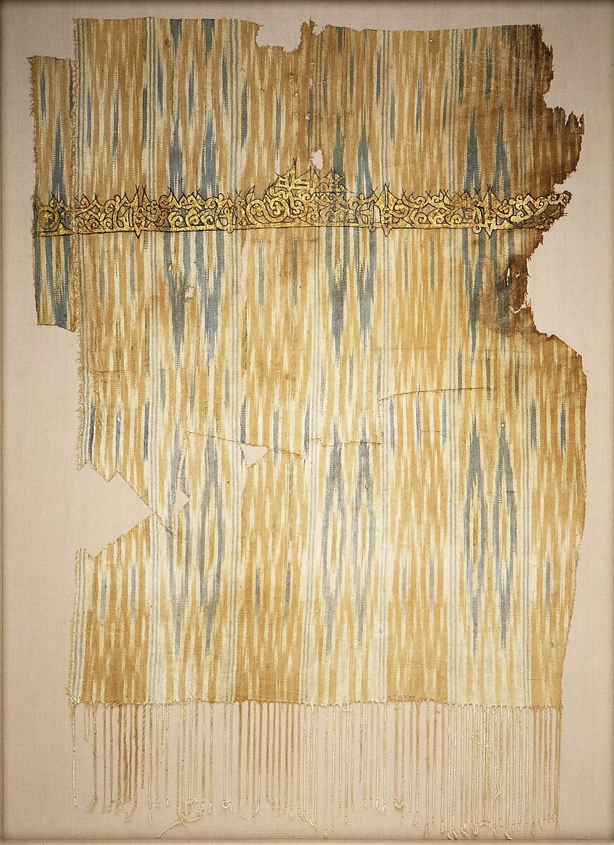 Tiraz Textile Fragment, Cotton, ink, and gold; plain weave, resist-dyed (ikat), painted
Inscription: black ink and gold leaf; painted