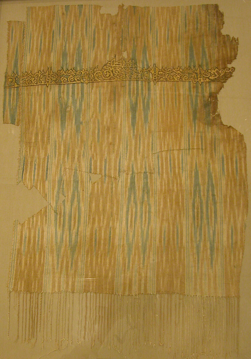 Tiraz Textile Fragment, Cotton, ink, and gold; plain weave, resist-dyed (ikat), painted
Inscription: black ink and gold leaf; painted