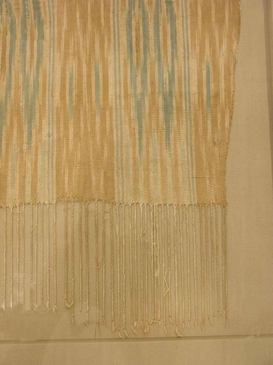Tiraz Textile Fragment, Cotton, ink, and gold; plain weave, resist-dyed (ikat), painted
Inscription: black ink and gold leaf; painted