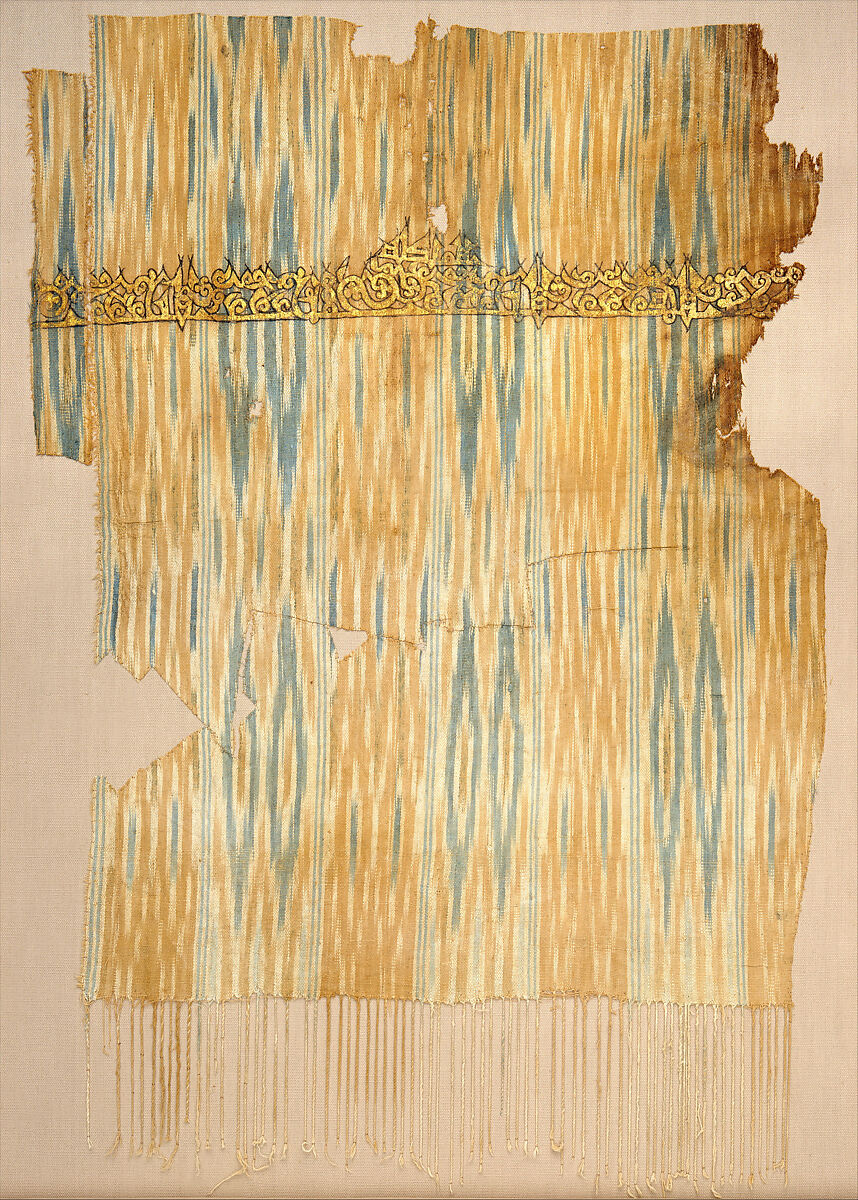 Tiraz Textile Fragment, Cotton, ink, and gold; plain weave, resist-dyed (ikat), painted
Inscription: black ink and gold leaf; painted