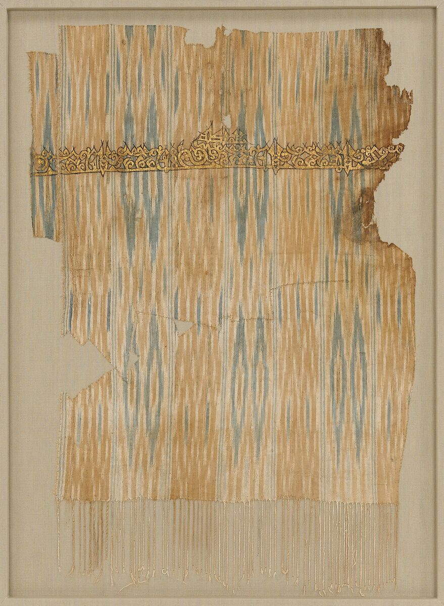 Tiraz Textile Fragment, Cotton, ink, and gold; plain weave, resist-dyed (ikat), painted
Inscription: black ink and gold leaf; painted 