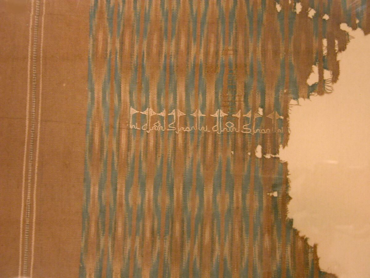 Fragment of an Embroidered Textile, Cotton; plain weave, resist-dyed (ikat), embroidered