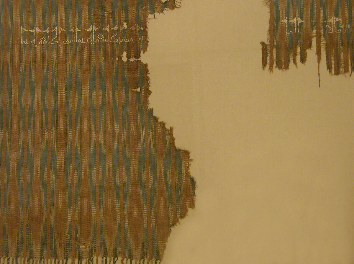 Fragment of an Embroidered Textile, Cotton; plain weave, resist-dyed (ikat), embroidered