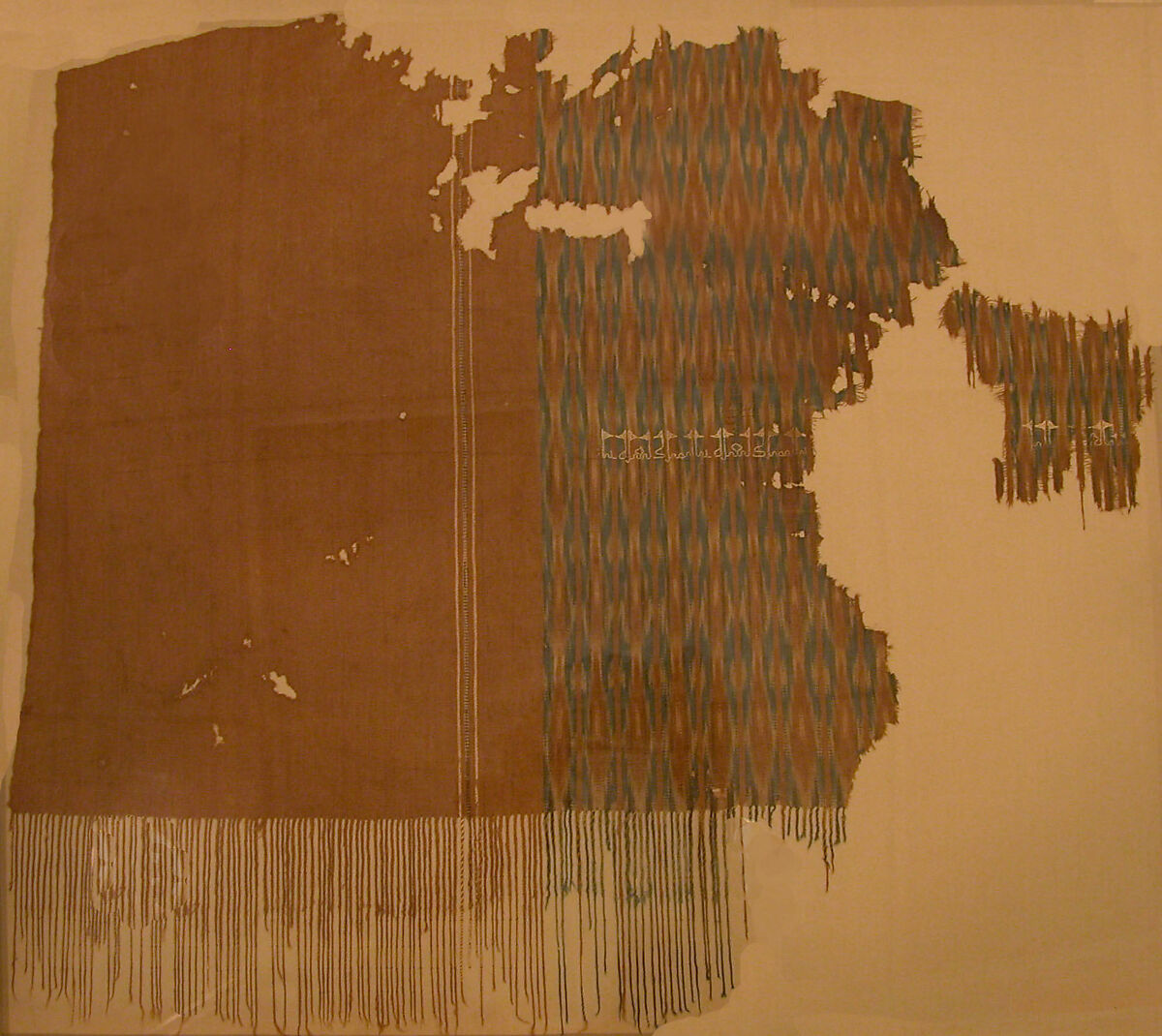 Fragment of an Embroidered Textile, Cotton; plain weave, resist-dyed (ikat), embroidered