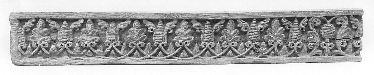Fragment of a Frieze with Winged Pinecones and Palmettes, Wood; carved
