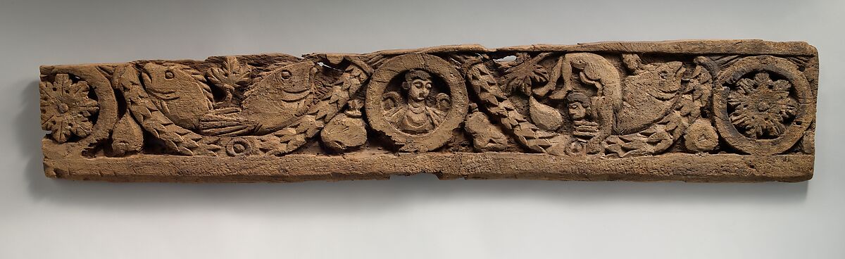 Fragment of a Frieze with Winged Pinecones and Palmettes, Wood; carved
