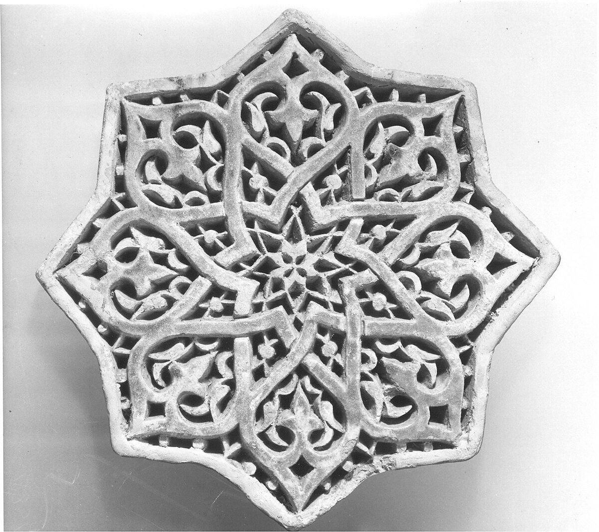 Carved Star Tile, Stonepaste; carved and partially glazed