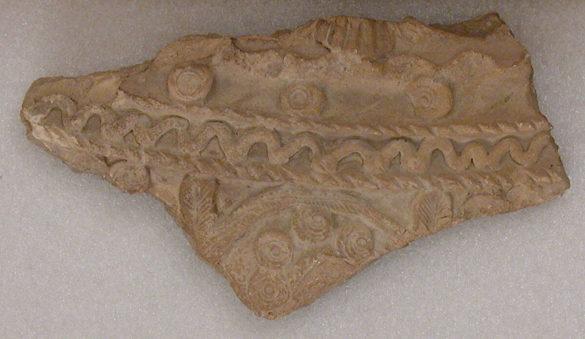 Fragment, Earthenware;  molded and stamped 