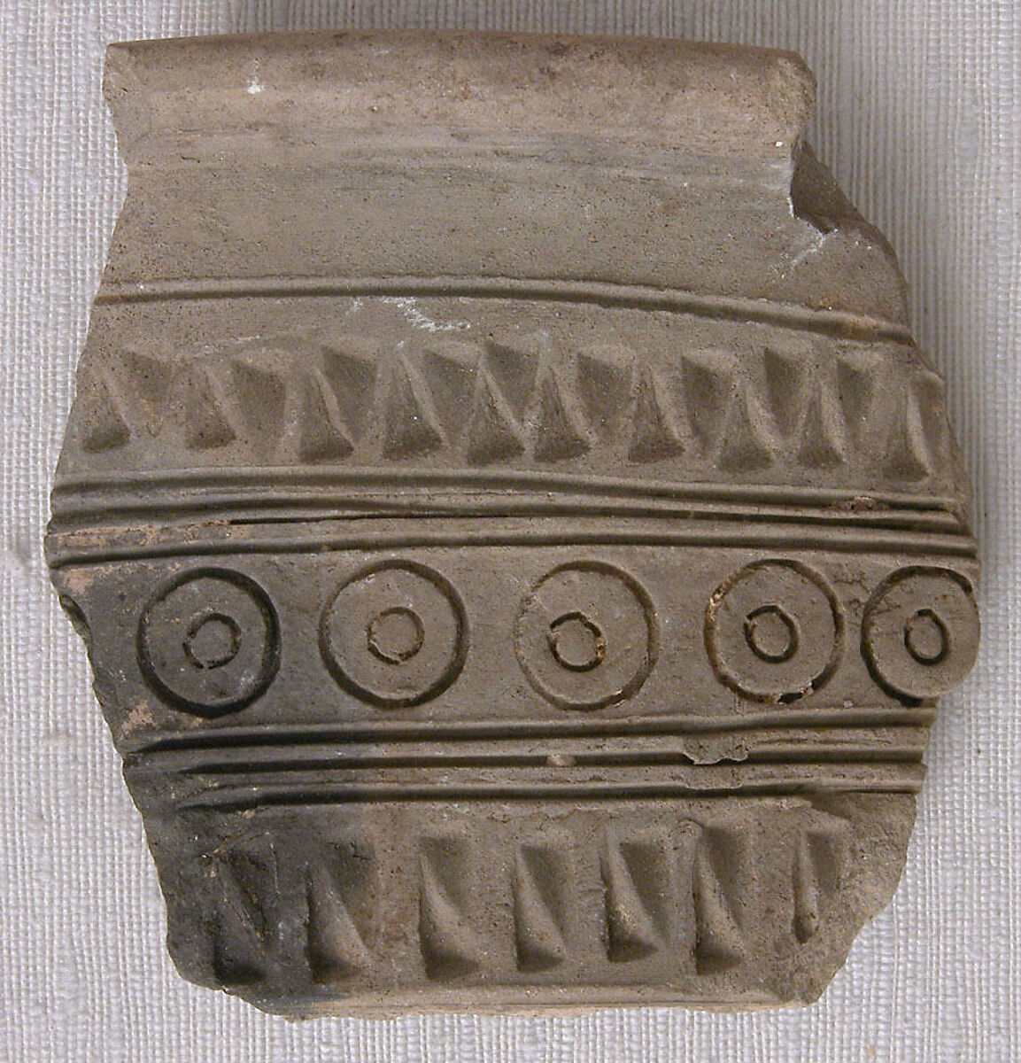 Fragment, Earthenware; molded and stamped 