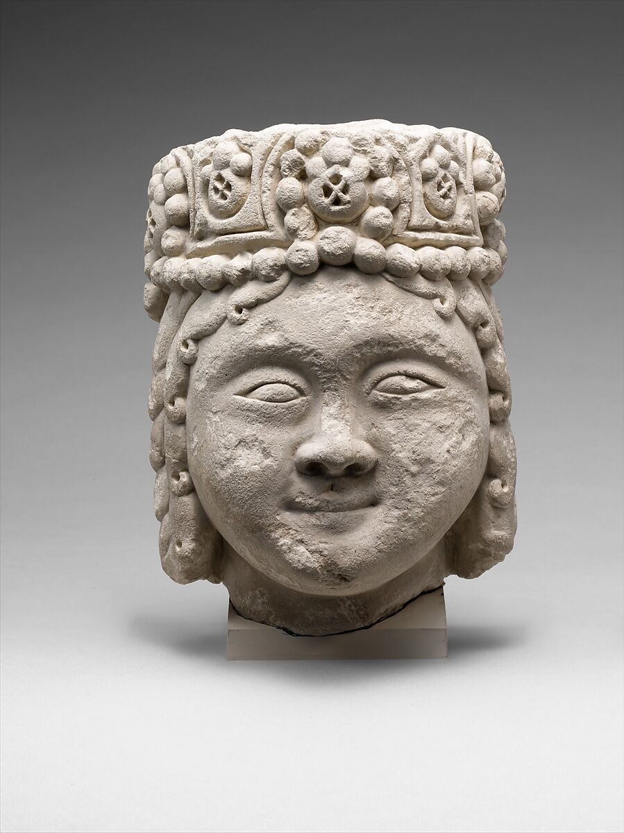 Head from a Figure with a Beaded Headdress, Fossiliferous limestone; carved, drilled 