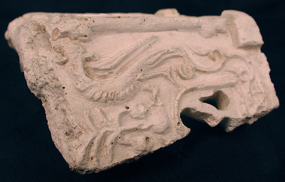 Fragment of a Base with Pair of Peacocks flanking a Palm Motif, Stucco; molded