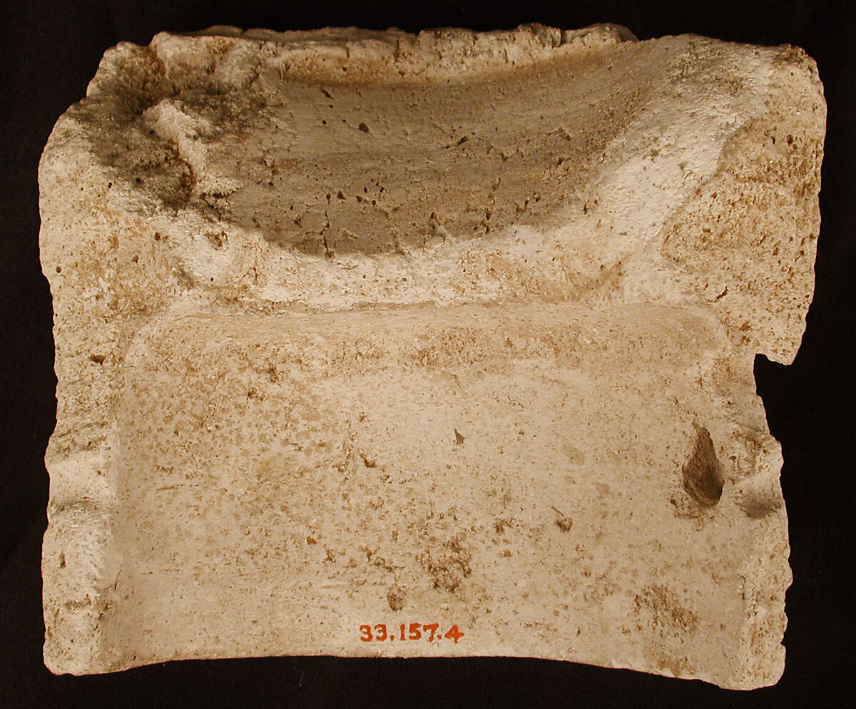 Fragment of a Base with Pair of Peacocks flanking a Palm Motif, Stucco; molded