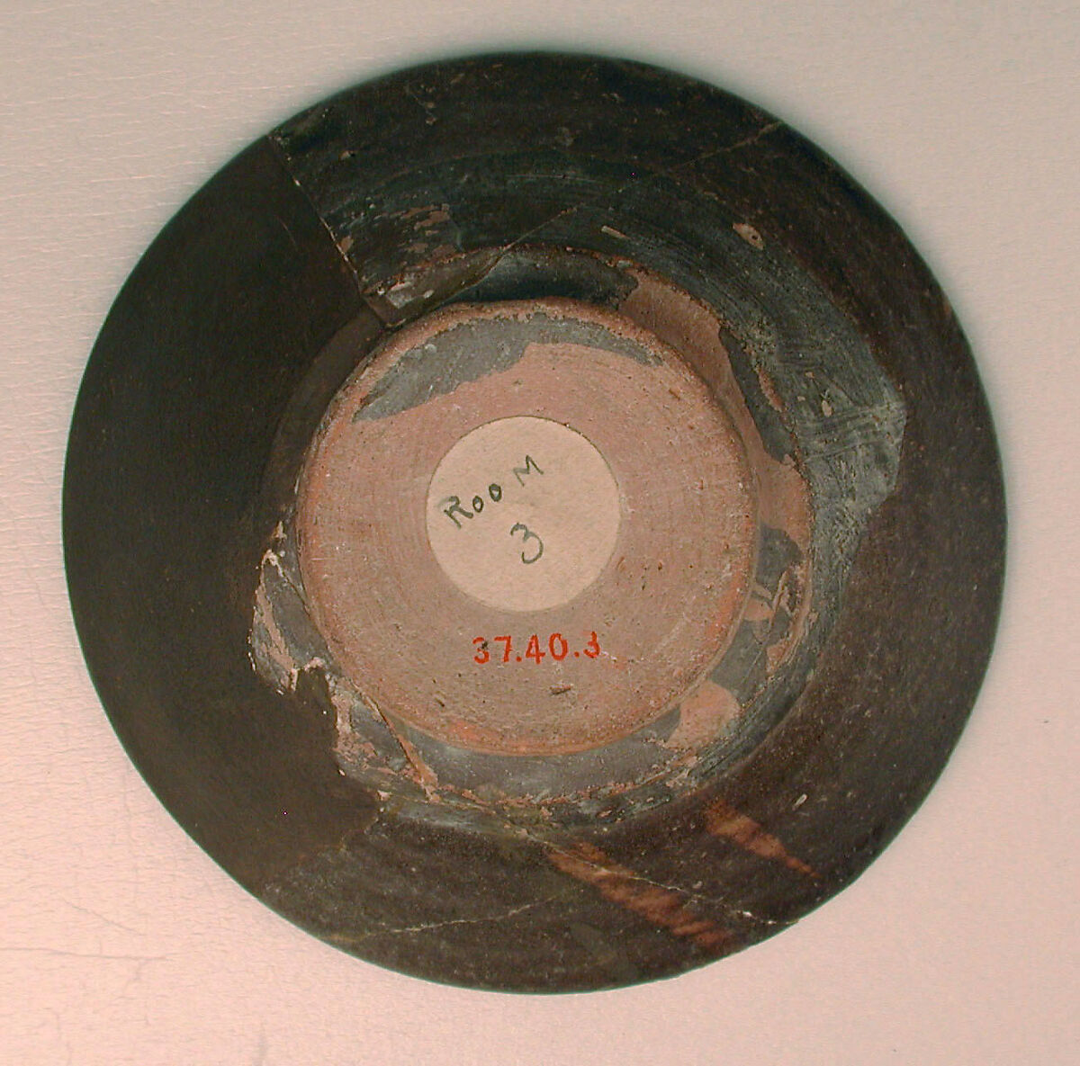 Bowl, Earthenware; brown slip with polychrome slip decoration under transparent glaze