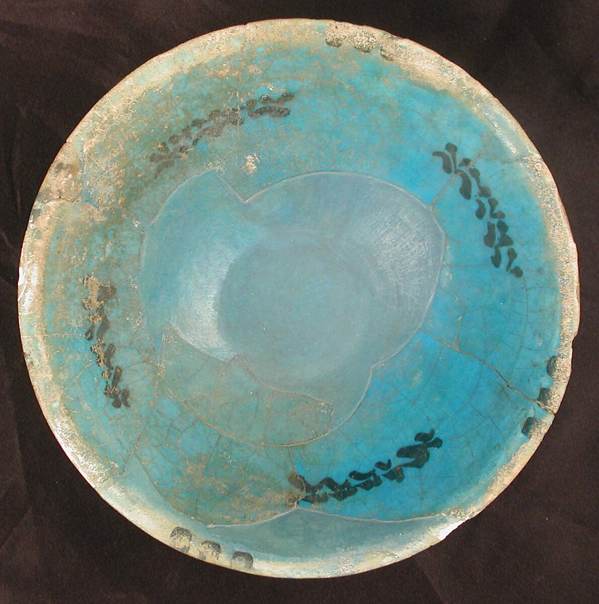 Bowl, Earthenware; white slip with black decoration under turquoise blue glaze 